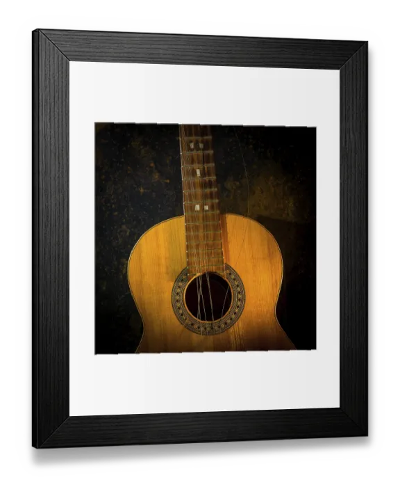 Framed Print : This classical guitar, resting against a dark brown backdrop