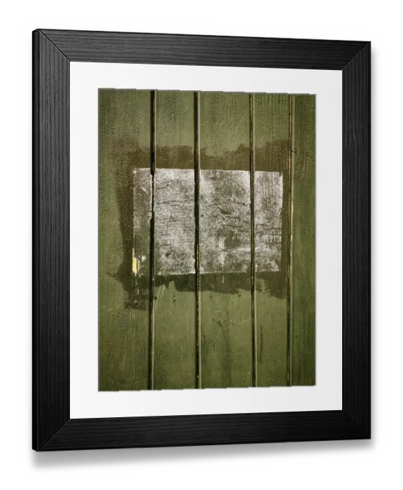 Framed Print : A rectangular patch on a green wooden surface shows faded remnants of a past application Framed Print : A rectangular patch on a green wooden surface shows faded remnants of a past application