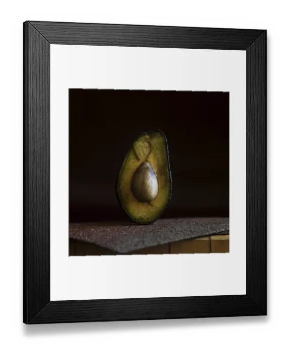Framed Print : A half avocado is placed on a rough