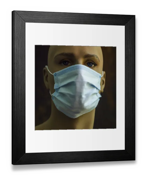 Framed Print : A mannequin displays a light blue surgical mask