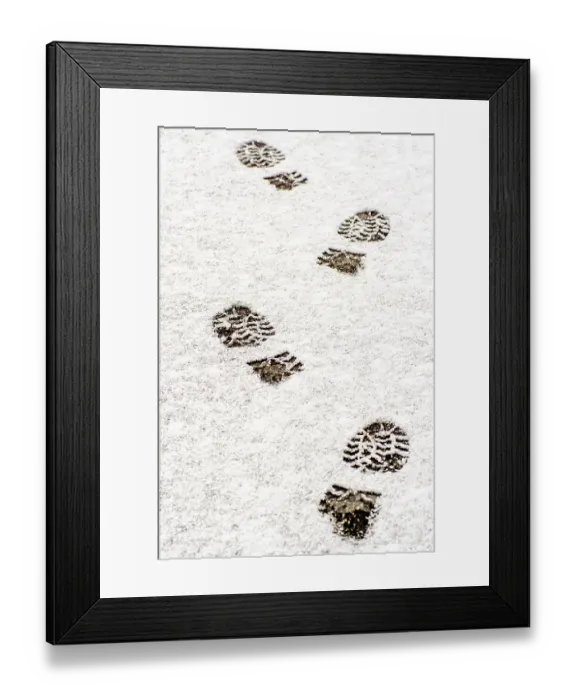 Framed Print : Tracks left by boots in freshly fallen snow reveal a path through a serene winter environment Framed Print : Tracks left by boots in freshly fallen snow reveal a path through a serene winter environment