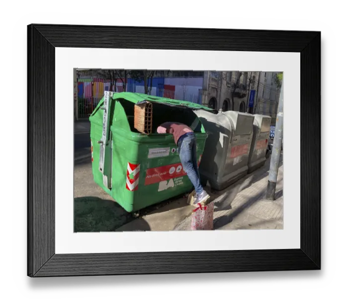 Framed Print : Poverty in Buenos Aires, a homeless man searches for something usable in a rubbish container Framed Print : Poverty in Buenos Aires, a homeless man searches for something usable in a rubbish container