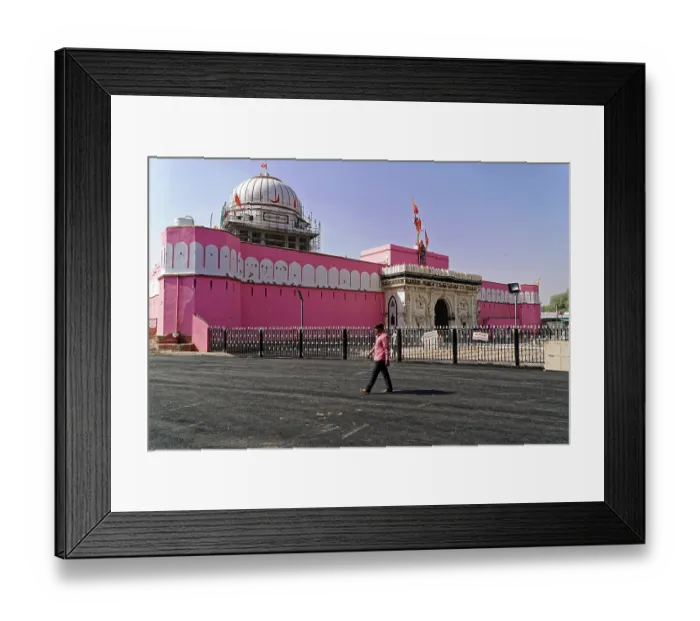 Framed Print : An impressive pink temple with striking architecture and historical flair under a blue sky Framed Print : An impressive pink temple with striking architecture and historical flair under a blue sky