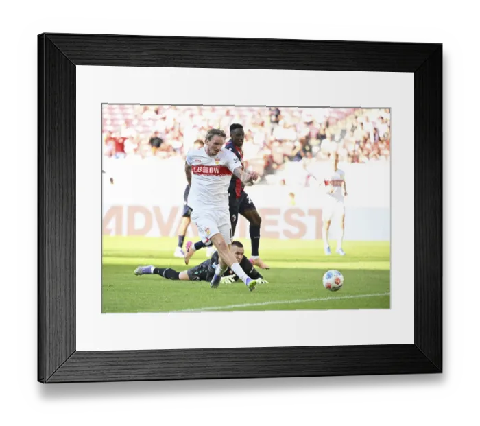 Framed Print : Goal kick Action Goal chance Nick Woltemade VfB Stuttgart (11) Goalkeeper Lukasz Skorupski FC Bologna (01) Framed Print : Goal kick Action Goal chance Nick Woltemade VfB Stuttgart (11) Goalkeeper Lukasz Skorupski FC Bologna (01)
