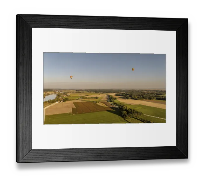 Framed Print : Two hot air balloons float calmly over the wide fields and the Danube (Lower Bavaria)