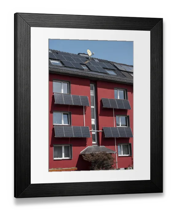 Framed Print : Residential building with photovoltaic modules on the facade and roof Framed Print : Residential building with photovoltaic modules on the facade and roof