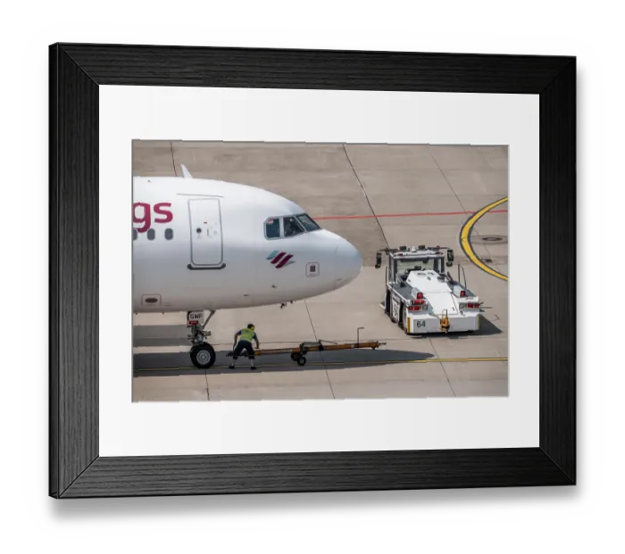 Framed Print : Dusseldorf Airport, Eurowings Airbus being towed from the gate