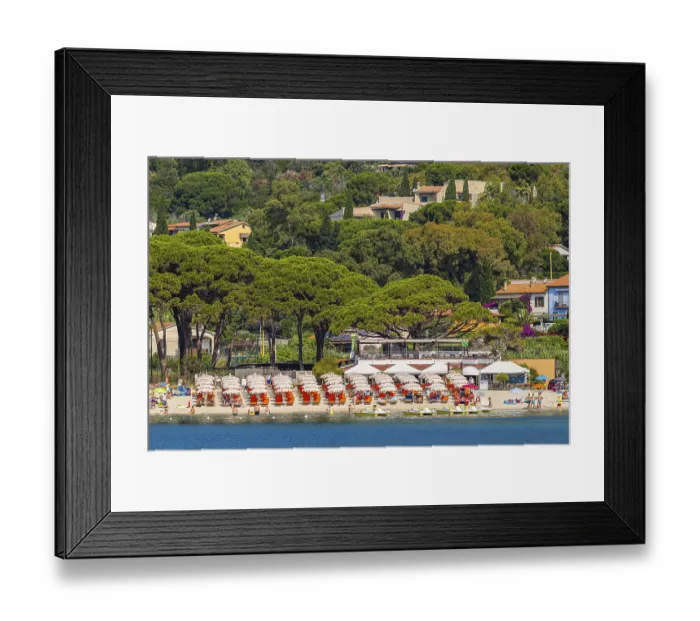 Framed Print : Sunbeds and parasols on the beach of Fetovaia
