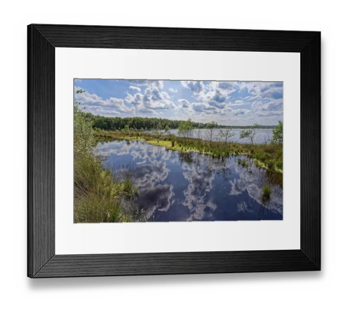 Framed Print : Clouds are reflected in the water surface of the Himmelmoor