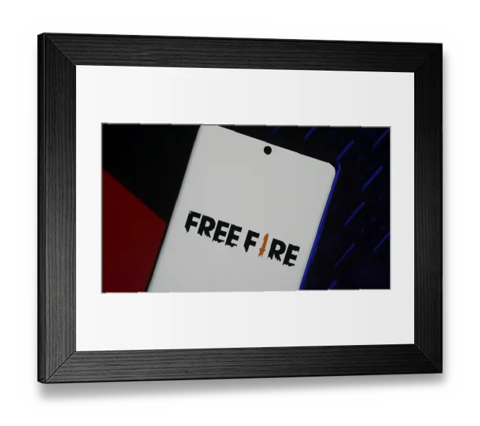Framed Print : Smartphone with Free Fire logo displayed on a neutral background Framed Print : Smartphone with Free Fire logo displayed on a neutral background