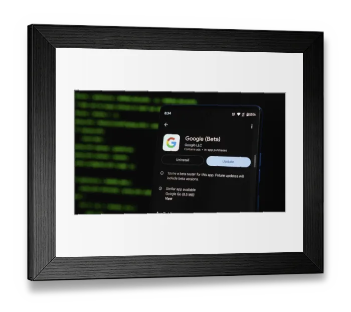 Framed Print : Google Beta app update interface on a smartphone screen with green text on a dark background