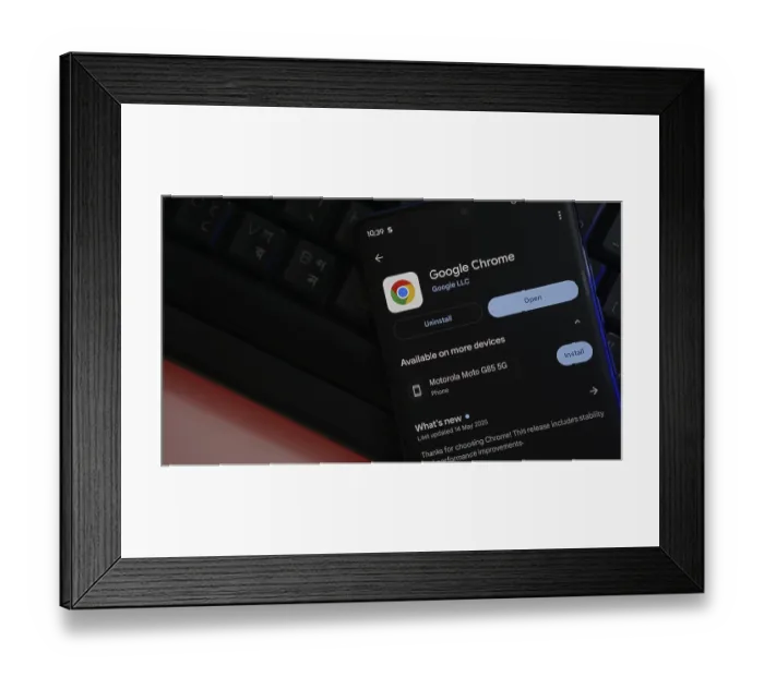 Framed Print : Google Chrome app screen on smartphone over keyboard