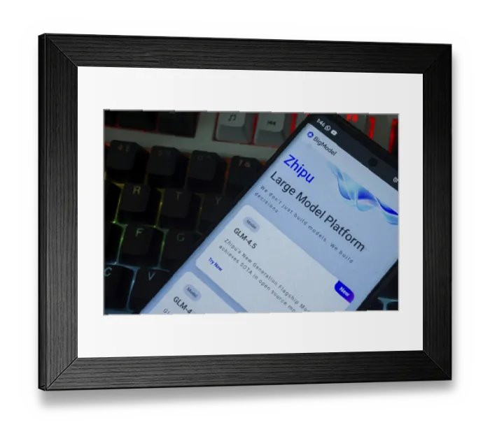 Framed Print : Smartphone displaying Zhipu platform interface with a backlit keyboard background
