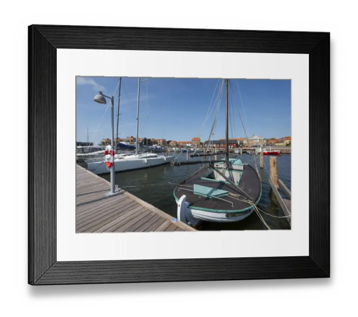 Framed Print : Old sailing boat in the harbour at a jetty Framed Print : Old sailing boat in the harbour at a jetty