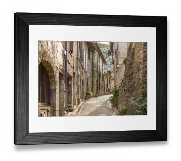 Framed Print : Narrow alley in the medieval village of Saint-Guilhem-le-Desert