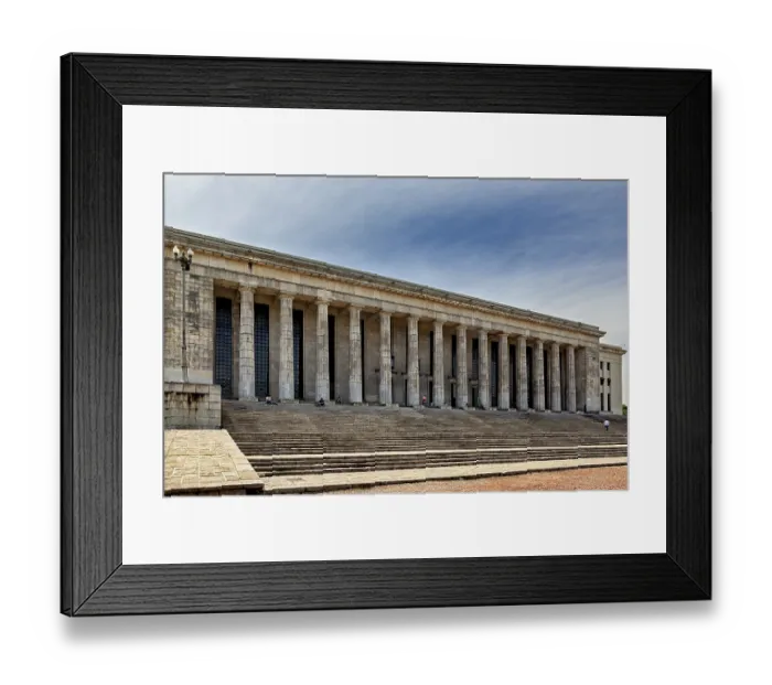 Framed Print : A wide building with many columns and large stairs in front of a slightly cloudy sky
