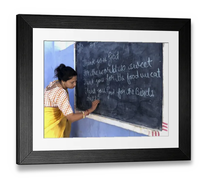 Framed Print : Teacher writing with chalk on the blackboard