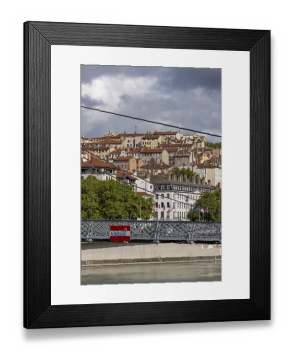 Framed Print : View of densely built houses through Passerelle du College