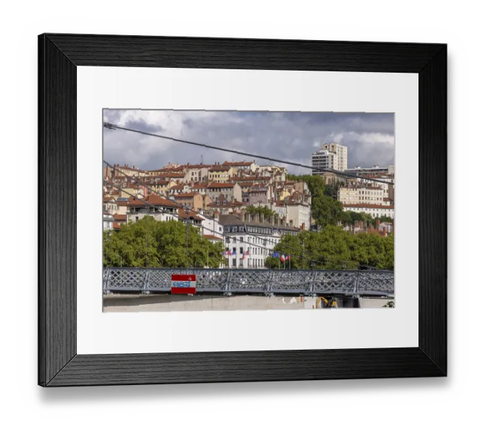 Framed Print : View of densely built houses through Passerelle du College