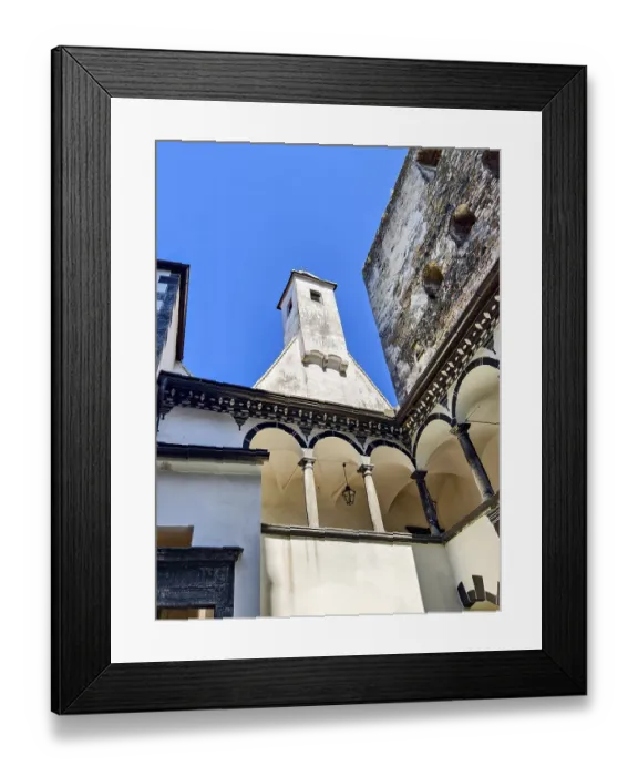 Framed Print : Inner courtyard with columns and tower under a clear blue sky