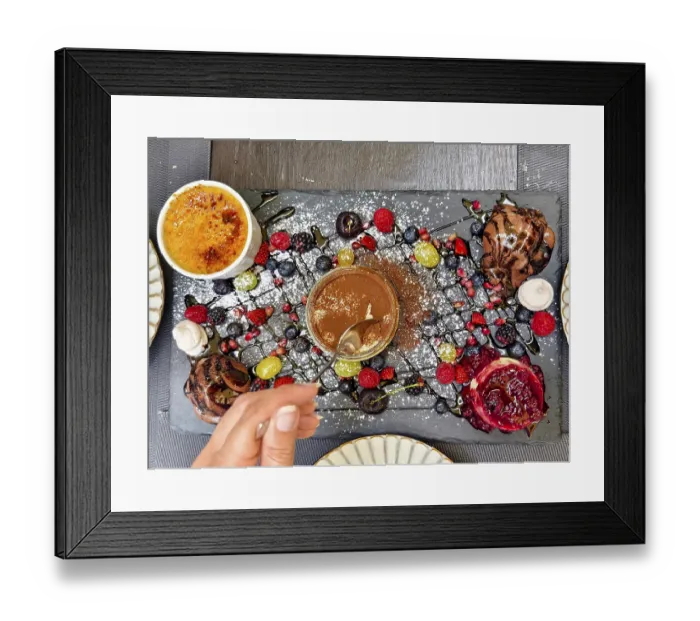 Framed Print : Hand with spoon tasting a dessert Framed Print : Hand with spoon tasting a dessert