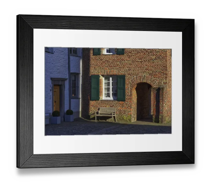 Framed Print : Red brick house with green shutters and bench in the shade