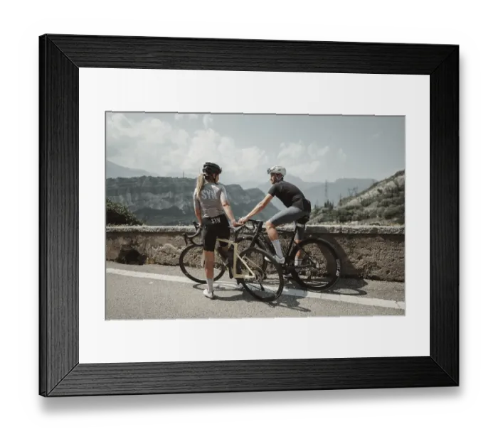 Framed Print : Woman and man cycling on Lake Garda in Italy Framed Print : Woman and man cycling on Lake Garda in Italy