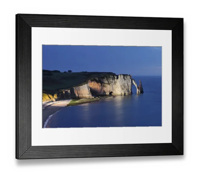Framed Print : Cliffs with the Falaise d'Aval rock gate and the Aiguille d'Etretat rock needle at night