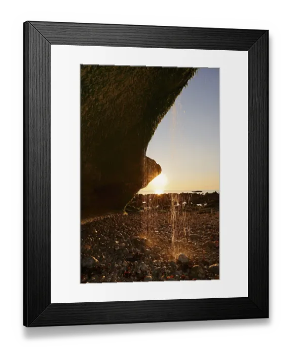 Framed Print : Waterfall on the cliffs backlit at sunset Framed Print : Waterfall on the cliffs backlit at sunset