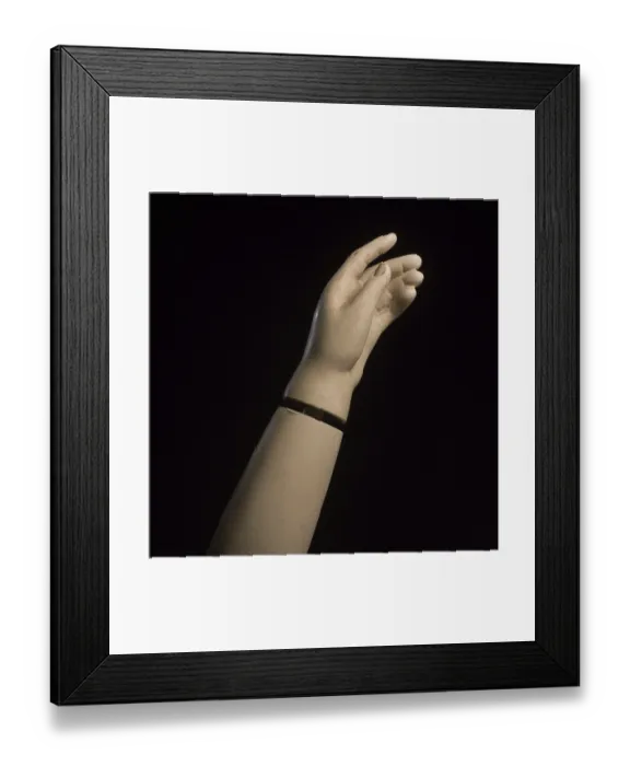 Framed Print : A detailed view of a mannequin hand with fingers slightly curled