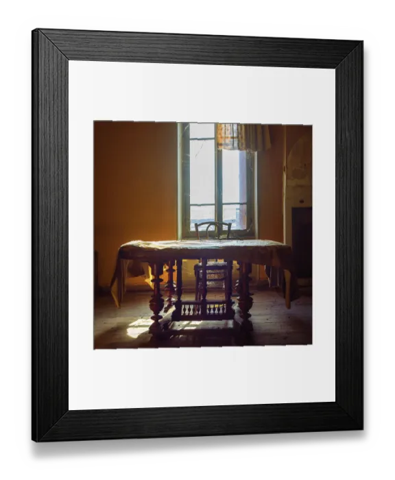Framed Print : Warm sunlight filters through an old window
