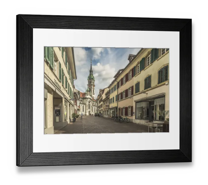Framed Print : Pedestrian zone and St Nicholas Catholic Church in the historic old town