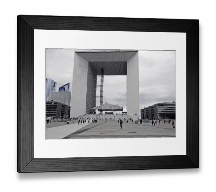 Framed Print : Large modern monument with people on the forecourt under a cloudy atmosphere