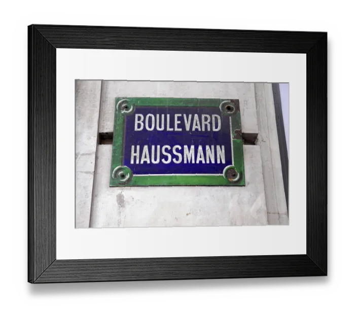 Framed Print : A street sign with the inscription Boulevard Haussmann in front of a grey wall