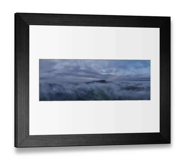 Framed Print : In the early morning, thick wafts of mist lie over the landscape