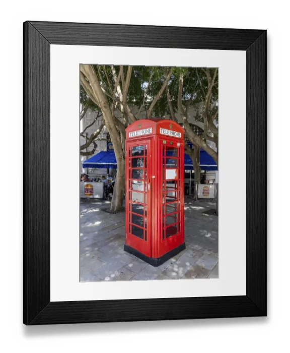 Framed Print : Red telephone boxes, a piece of British culture in the old town Framed Print : Red telephone boxes, a piece of British culture in the old town