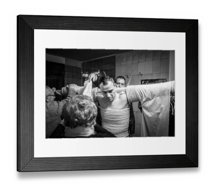 Framed Print : A man is tied to a cross with hemp ropes
