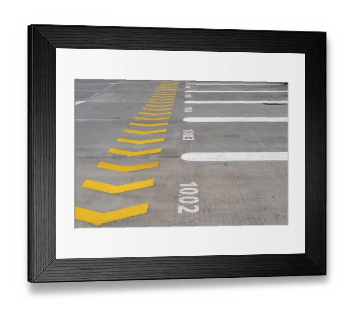 Framed Print : Markings on a car park deck, Direction of travel marking