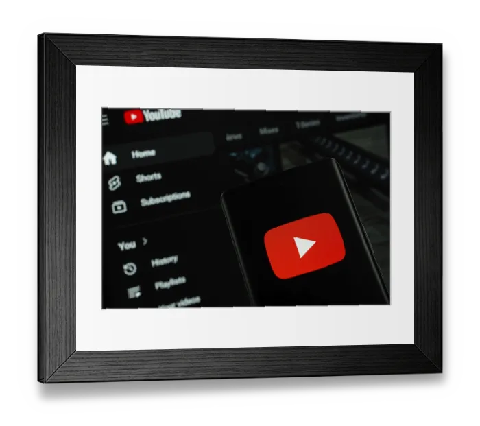 Framed Print : Dhaka, Bangladesh- 10 July 2025: Youtube logo is displayed on a smartphone screen Framed Print : Dhaka, Bangladesh- 10 July 2025: Youtube logo is displayed on a smartphone screen