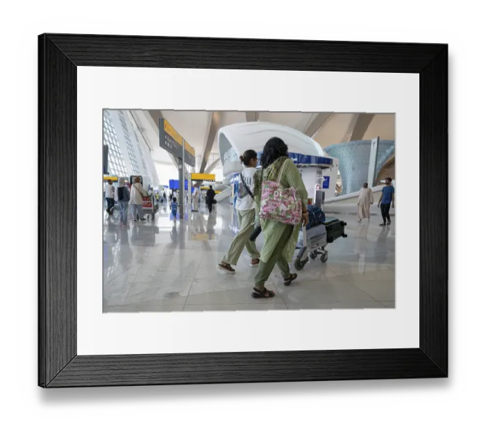 Framed Print : Airport Women with luggage, Abu Dhabi
