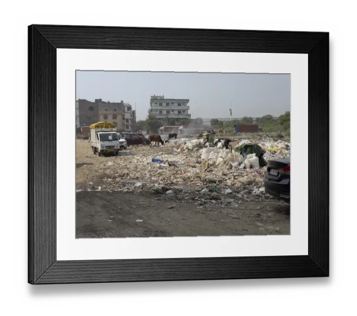 Framed Print : Large-scale waste disposal on a road with vehicles