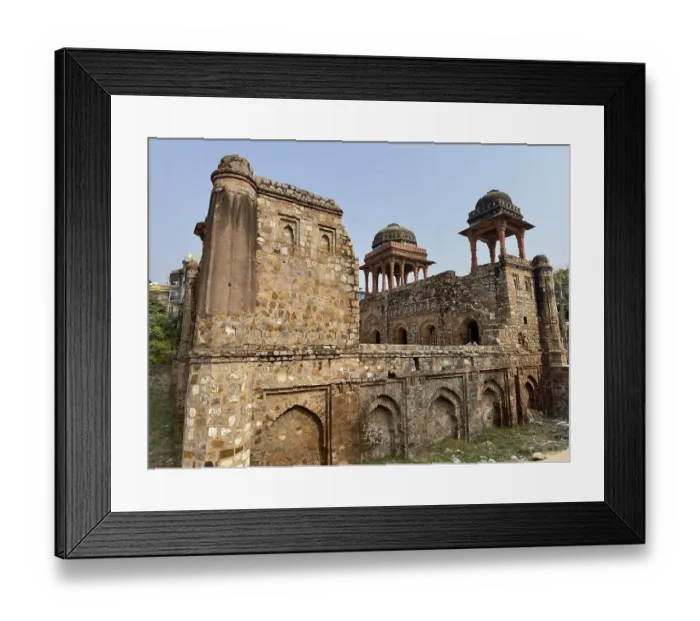 Framed Print : Ancient stone walls of a fortress with towers and domes under a blue sky