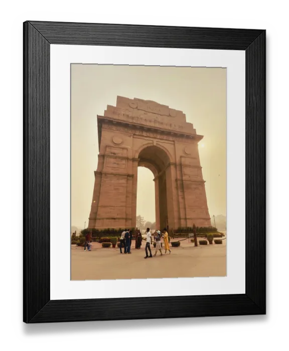 Framed Print : Large archway at dusk with people in the foreground and a sky slightly illuminated by the sun