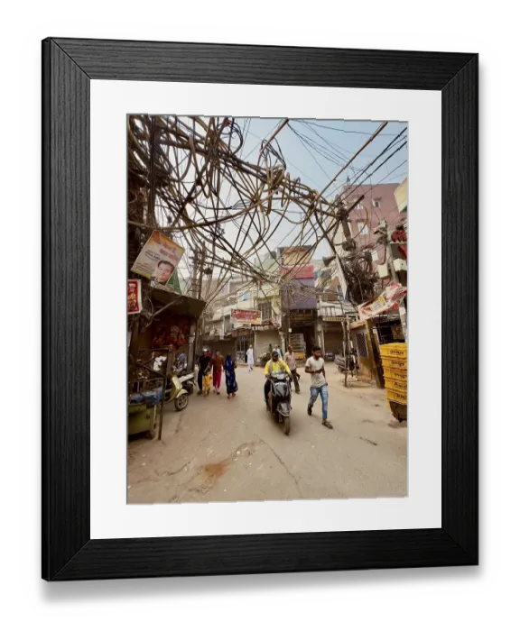 Framed Print : Street scene with people and hanging cables Framed Print : Street scene with people and hanging cables