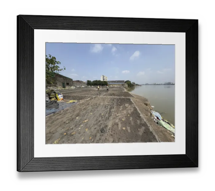 Framed Print : View of a large open area on the river bank under a clear sky