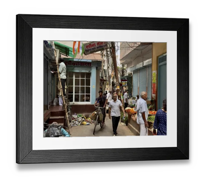 Framed Print : Busy street view with people and a bicycle