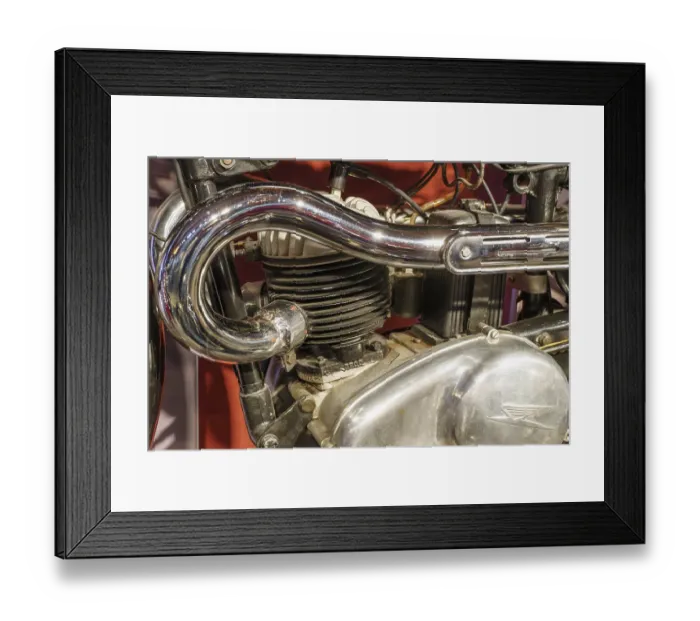 Framed Print : Close-up of a motorbike engine with chrome-plated exhaust pipe