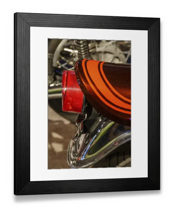 Framed Print : Close-up of a motorbike tail light with chrome details and retro stripe pattern Framed Print : Close-up of a motorbike tail light with chrome details and retro stripe pattern
