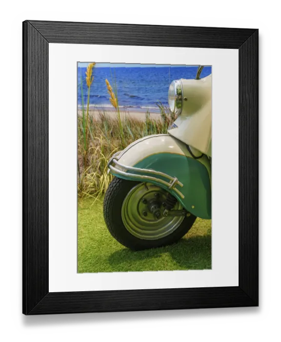 Framed Print : Front wheel of a cream-coloured scooter with turquoise accents on the beach Framed Print : Front wheel of a cream-coloured scooter with turquoise accents on the beach
