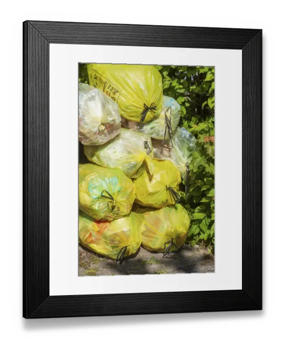 Framed Print : Stacked yellow bags for plastic waste, Germany Framed Print : Stacked yellow bags for plastic waste, Germany
